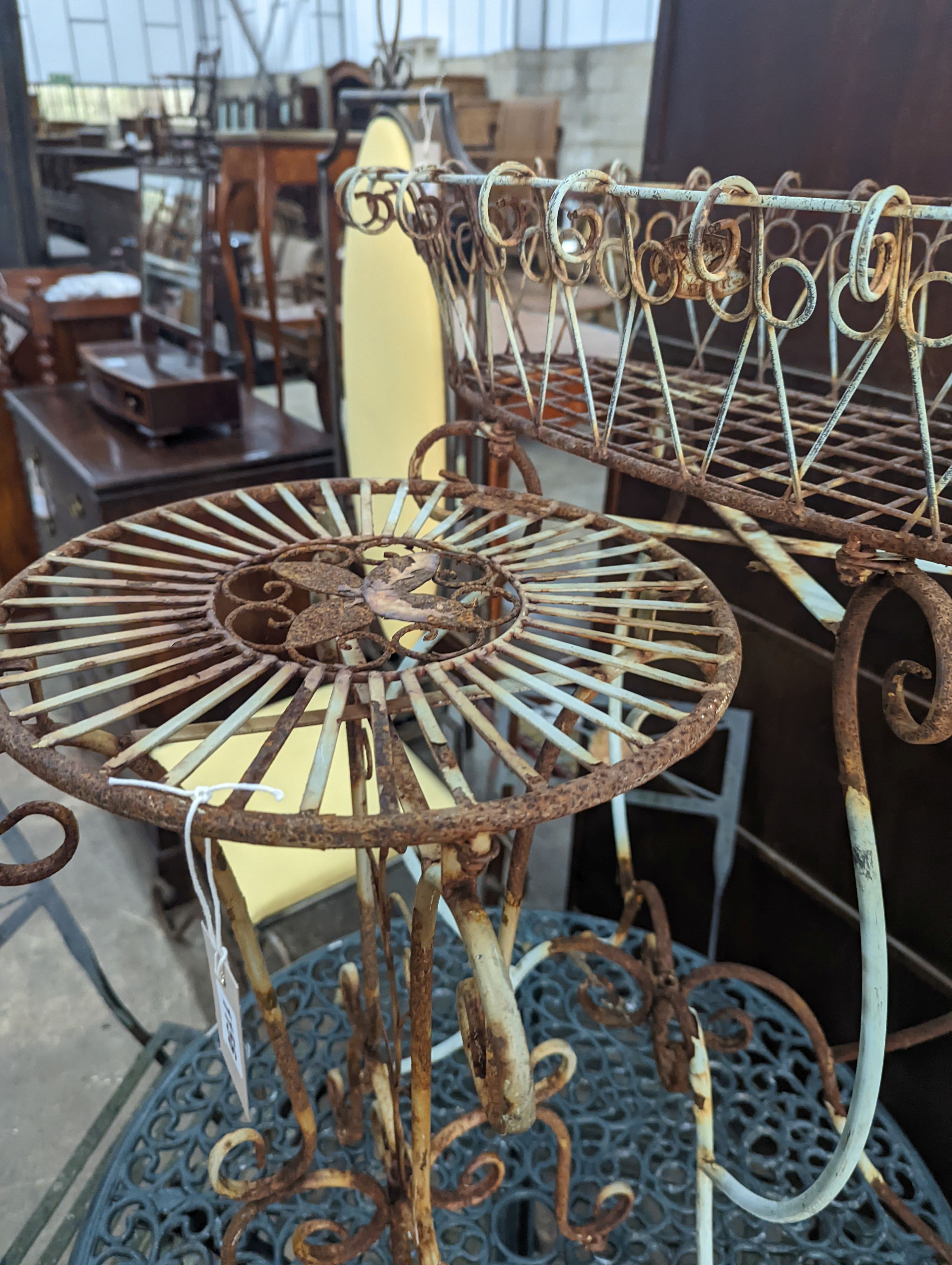 A painted wirework and wrought iron pot stand, height 79cm together with a similar circular table